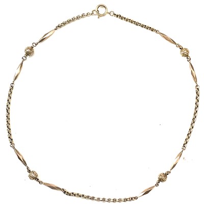 Lot 65 - A Victorian 9ct rose gold belcher, foliate engraved ball and facet barrel necklace.