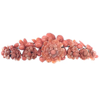 Lot 231 - A 19th century coral hair ornament, silver set, decorated with flower heads and peaches.