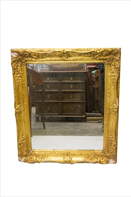 Lot 3294 - A gilt composition rectangular wall mirror,...