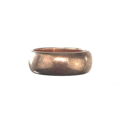 Lot 205 - A 9ct rose gold band ring.