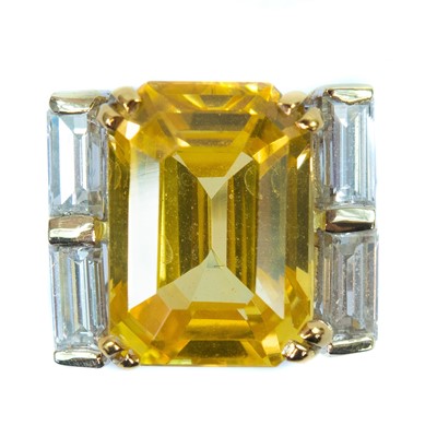 Lot 396 - Boucheron - A yellow sapphire and diamond platinum ring.