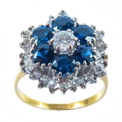 Lot 159 - A diamond and sapphire cluster ring