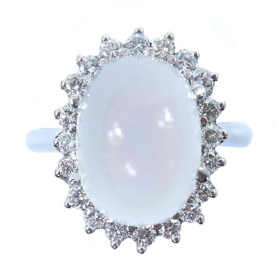 Lot 77 - An 18ct white gold moonstone and diamond cluster ring.