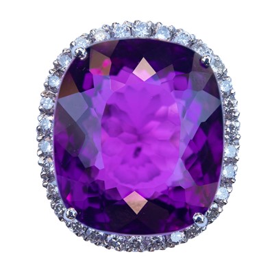 Lot 168 - An 18ct white gold amethyst and diamond cluster dress ring.