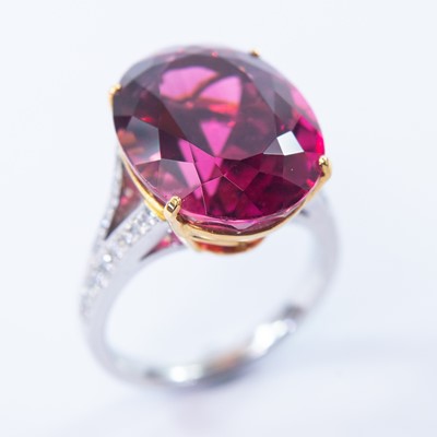 Lot 50 - An 18ct white and yellow gold pink topaz dress ring.