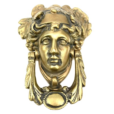 Lot 53 - A brass door knocker modelled as a Classical...