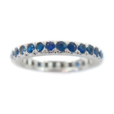 Lot 82 - An 18ct white gold sapphire set full eternity ring.