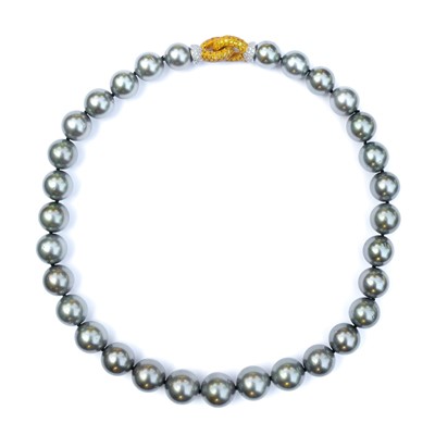 Lot 23 - A grey cultured pearl necklace with 18ct bi-colour gold yellow and white diamond clasp.