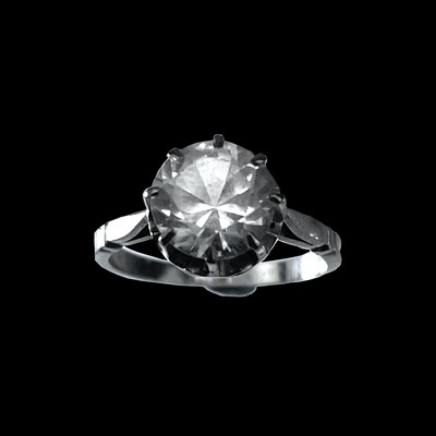 Lot 155 - An 18ct (tested) white gold white gem set solitaire ring.