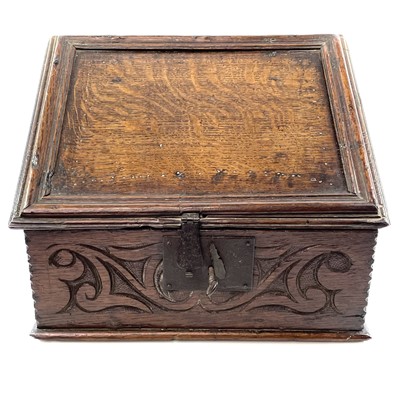 Lot 1 - A carved oak bible box, 17th century.