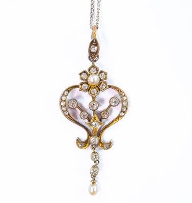 Lot 166 - An Edwardian gold diamond and pearl set openwork pendant.