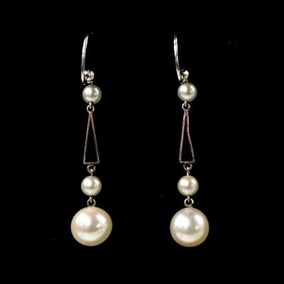 Lot 187 - A pair of early 20th century 9ct white gold and pearl drop earrings.