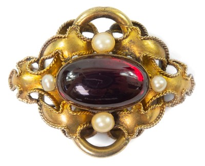 Lot 64 - A Victorian gold carbuncle brooch.