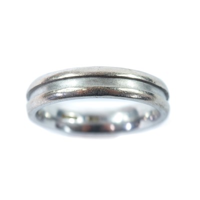 Lot 188 - A modern 18ct hallmarked white gold band ring.