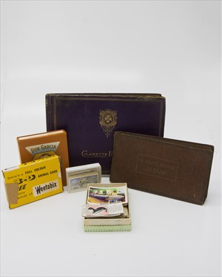 Lot 558 - Cigarette & Trade Cards. Two albums and loose,...