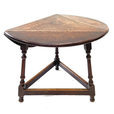 Lot 54 - An oak drop leaf occasional table, early 20th century, of triangular form.