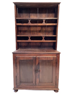 Lot 23 - A continental walnut kitchen dresser, 19th century.