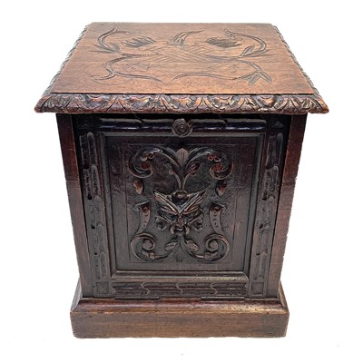 Lot 36 - A Victorian carved oak coal box.
