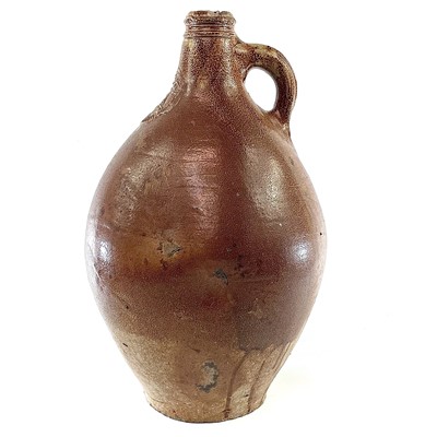 Lot 46 - A German salt glaze stoneware bellarmine, 17th century.