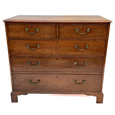 Lot 55 - A George III oak chest of drawers.