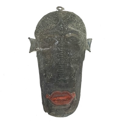 Lot 98 - An unusual African Benin type bronze wall mask,...