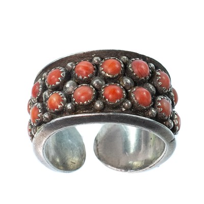 Lot 279 - A Navaho silver coral set ring