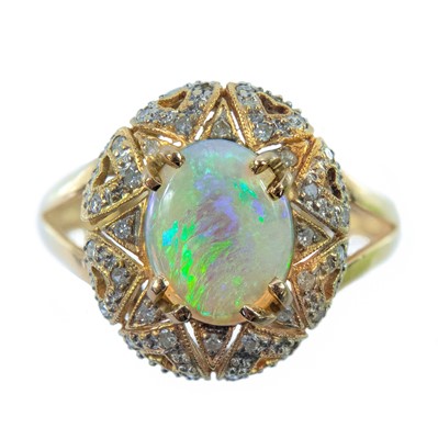 Lot 2 - An 18ct gold diamond and white opal dress ring