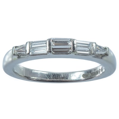 Lot 208 - A contemporary platinum and diamond eight stone ring.