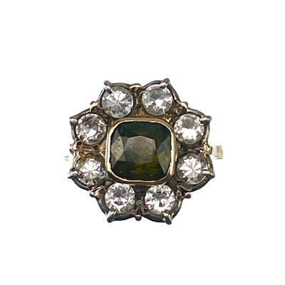 Lot 183 - An 18ct white sapphire and green garnet set ring