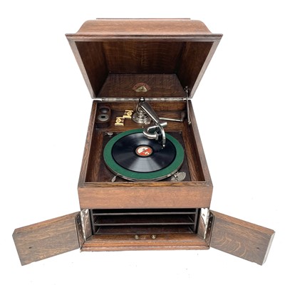 Lot 50 - An HMV oak table top wind-up gramophone,...