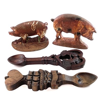 Lot 120 - Two cast iron doorstops in the form of pigs