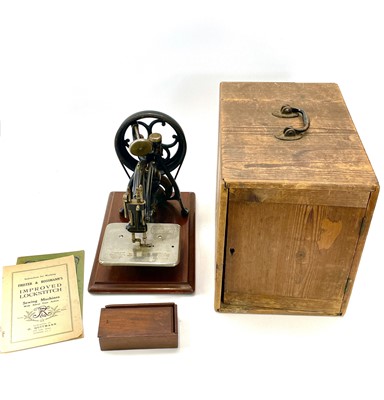 Lot 236 - A Willcox & Gibbs chain stitch sewing machine,...
