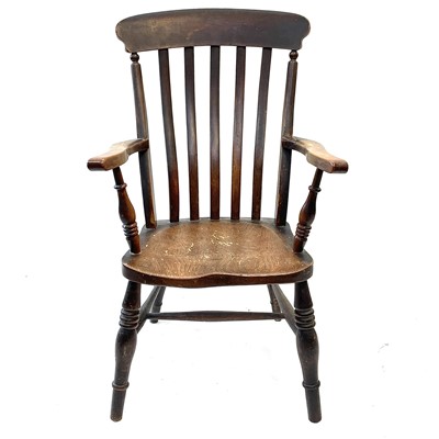 Lot 141 - A Victorian lathe back elm and beech kitchen armchair.