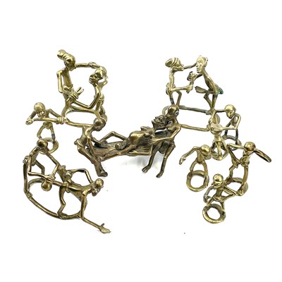 Lot 271 - An Ashanti bronze group of a women giving...