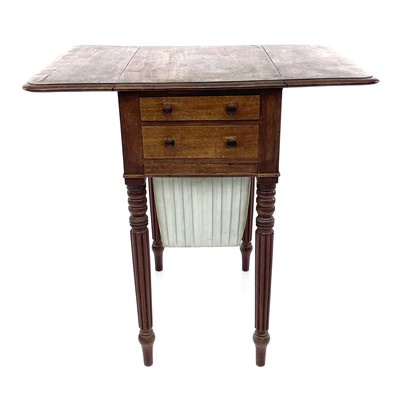Lot 1866 - A Regency mahogany and rosewood banded twin flap work table.