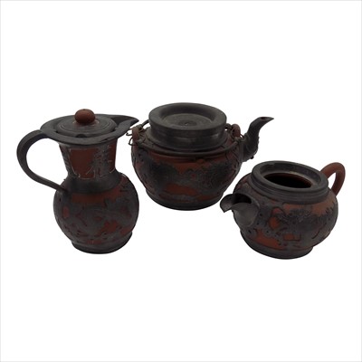 Lot 1101 - A Chinese yixing and pewter three piece tea...
