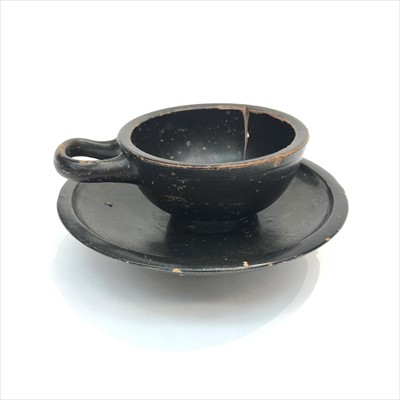 Lot 1493 - An ancient Greek cup and stand, black glazed...
