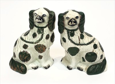 Lot 1455 - A pair of Victorian Staffordshire spaniel...