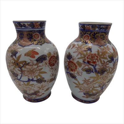 Lot 1122 - A pair of Japanese Imari porcelain baluster...