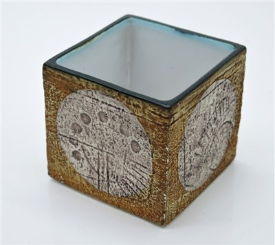 Lot 1329 - A Troika cube vase, the orange body with pale...