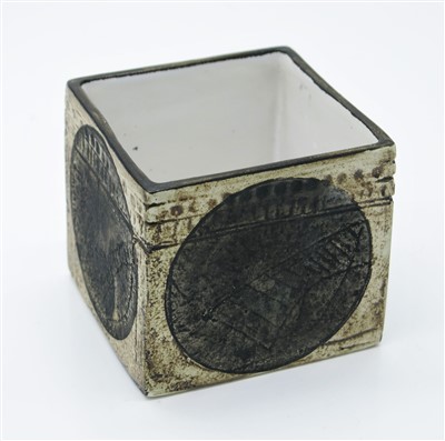 Lot 1327 - A Troika cube vase, the cream body decorated...