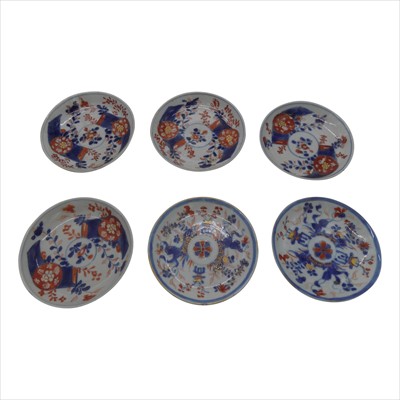 Lot 1135 - A set of four Chinese Imari saucer dishes, and...