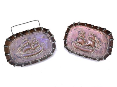 Lot 63 - A pair of copper pin dishes, circa 1900, with repousse decoration of twin masted sailing ships.