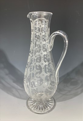 Lot 1336 - A Victorian cut and engraved glass claret jug.