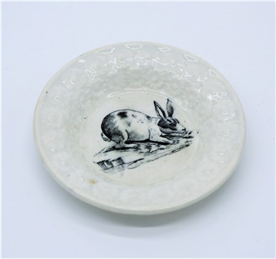 Lot 1338 - A creamware nursery plate, circa. 1900, with...