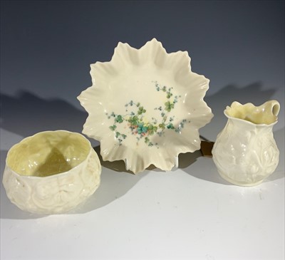 Lot 1341 - A Belleek milk jug and sugar basin, and a...