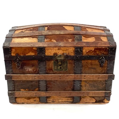 Lot 1881 - An oak and metal banded dome top trunk.