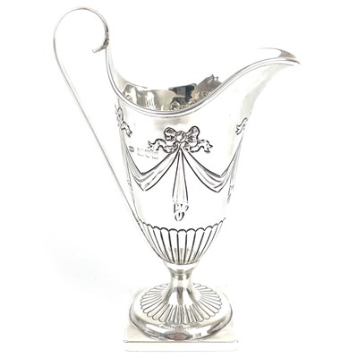 Lot 99 - A Victorian silver Adam style pedestal cream jug by George Fricker.