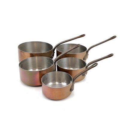 Lot 61 - A graduated set of six French copper saucepans.