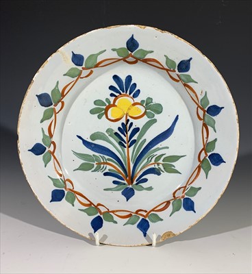 Lot 1370 - A Bristol delft plate, circa 1730, with floral...